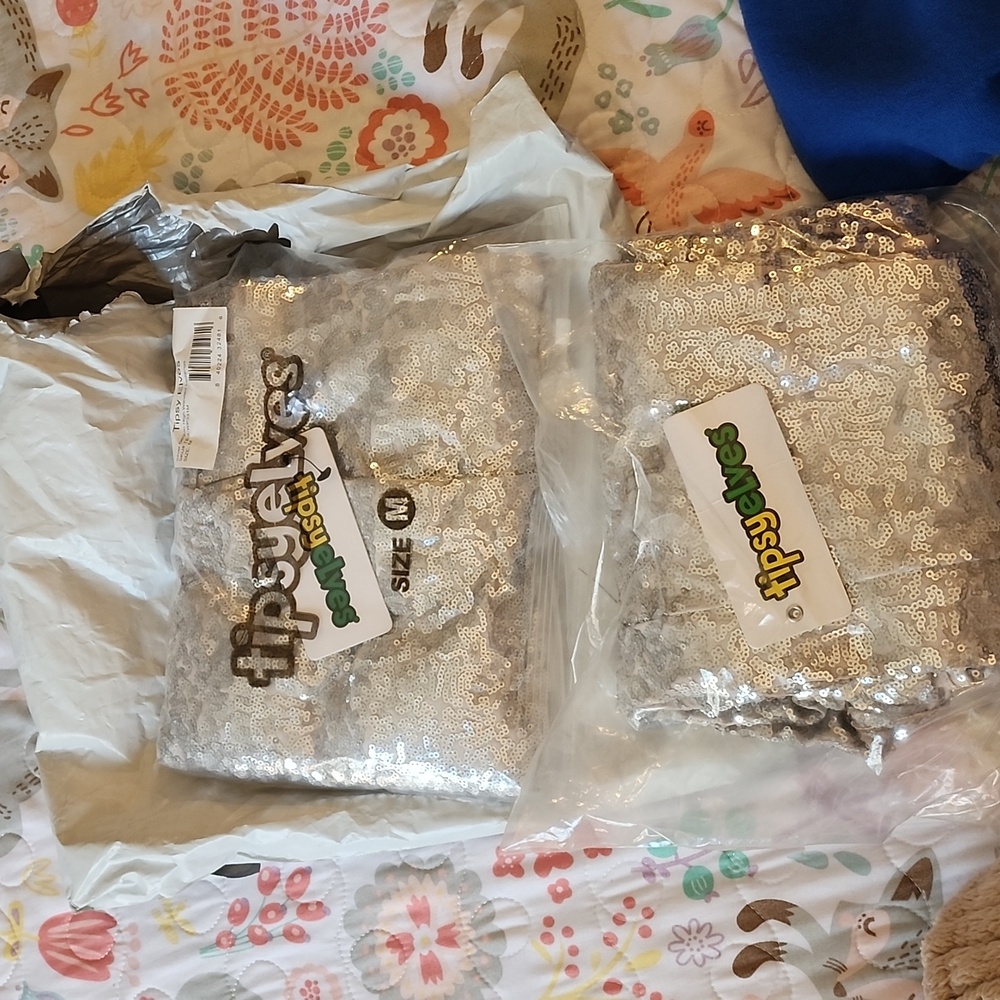 2 pairs of silver sequin leggings. Both brand new.